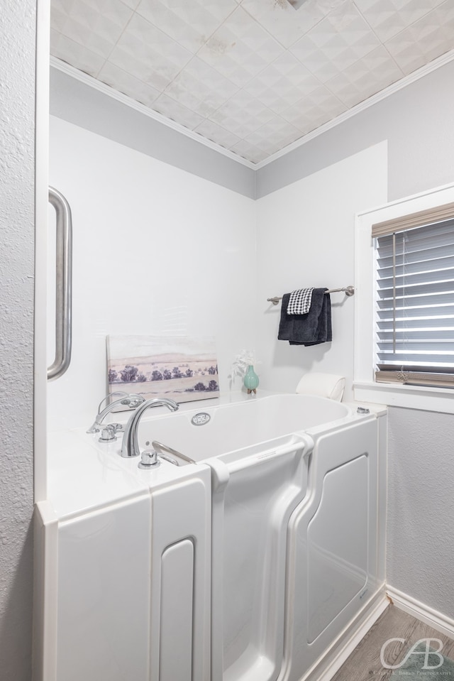 laundry area with crown molding