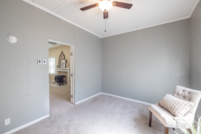 unfurnished room with ceiling fan, light colored carpet, crown molding, and wooden ceiling