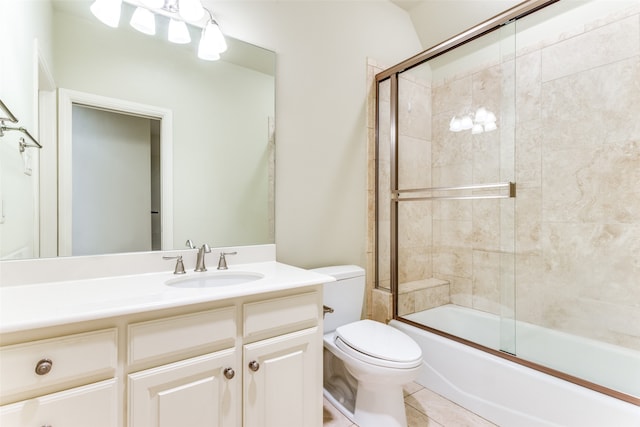 full bathroom with vanity, tile patterned flooring, enclosed tub / shower combo, and toilet