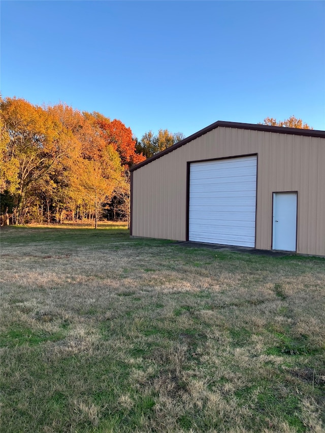 exterior space with a lawn and a garage