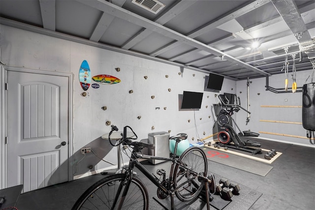 exercise room featuring concrete flooring