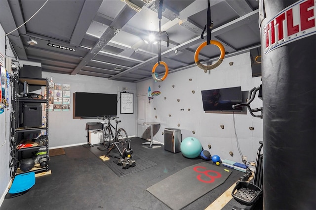 workout room featuring concrete flooring