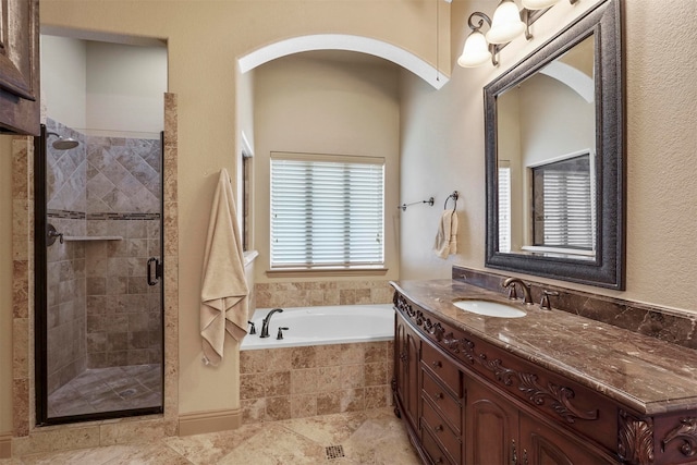 bathroom with tile patterned floors, plus walk in shower, and vanity