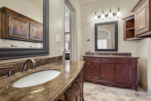 bathroom with tile patterned flooring and double sink vanity