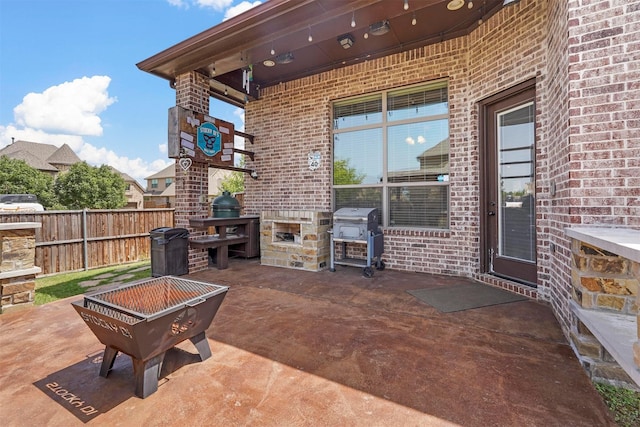 view of patio / terrace featuring area for grilling and an outdoor fire pit