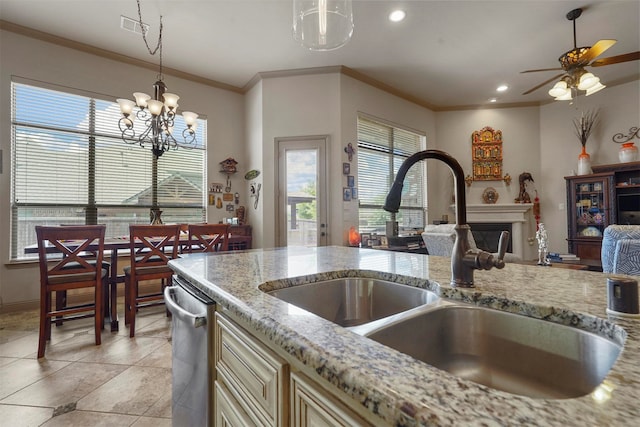 kitchen with decorative light fixtures, light tile patterned floors, light stone countertops, ceiling fan with notable chandelier, and dishwasher