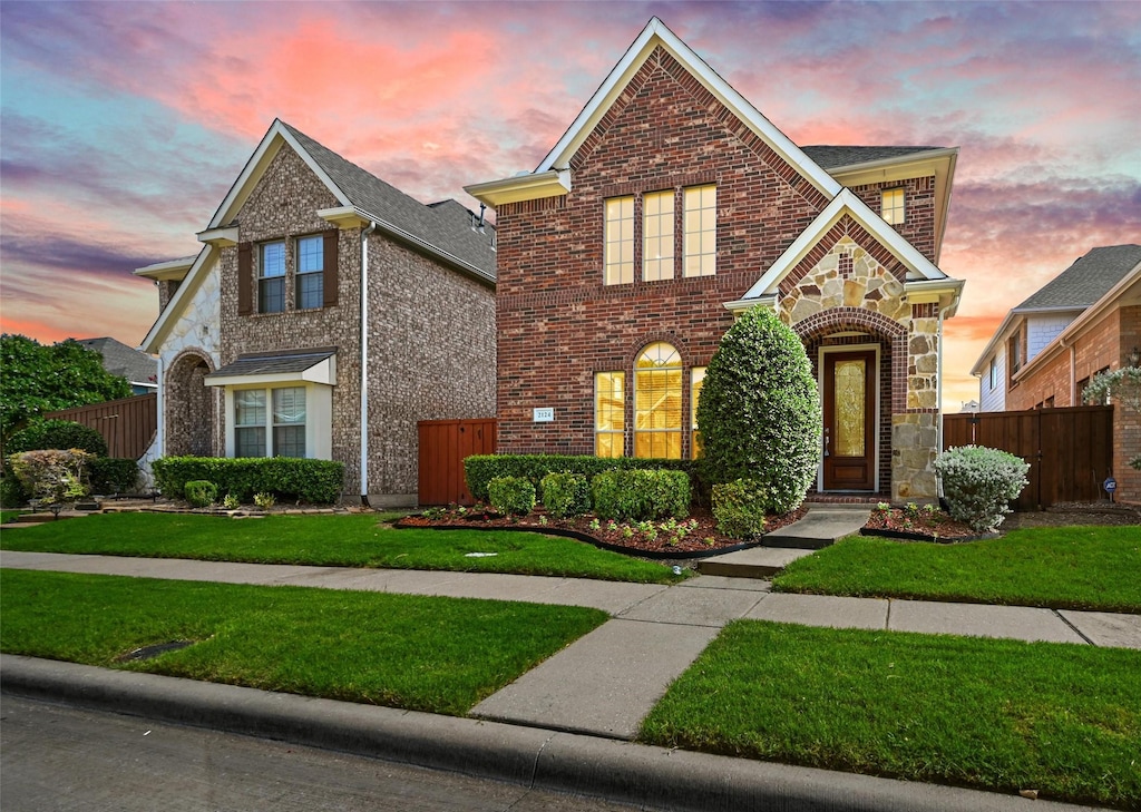 view of front of property with a lawn