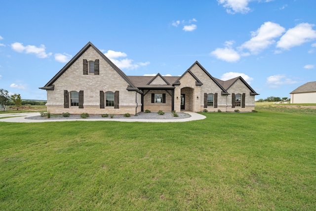 french country home with a front yard