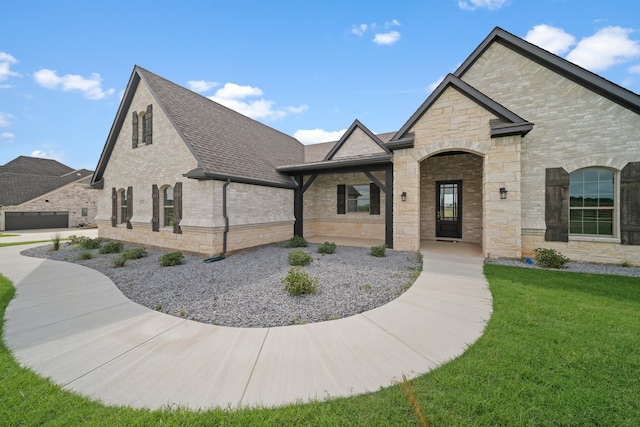 french provincial home with a front lawn