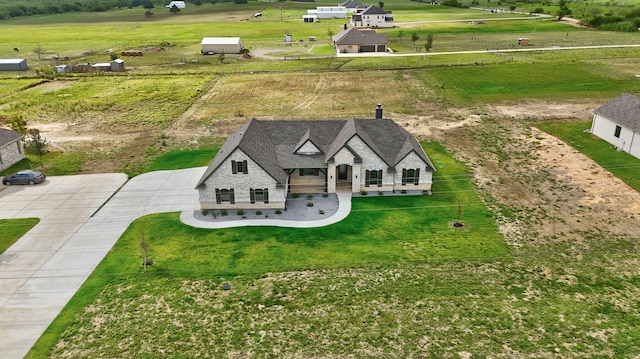 birds eye view of property featuring a rural view