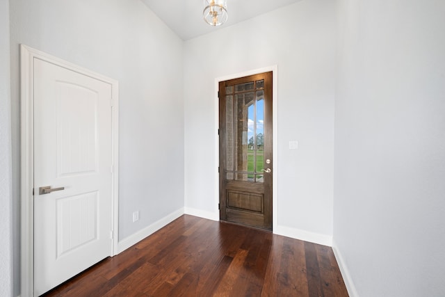 entryway with dark wood-type flooring