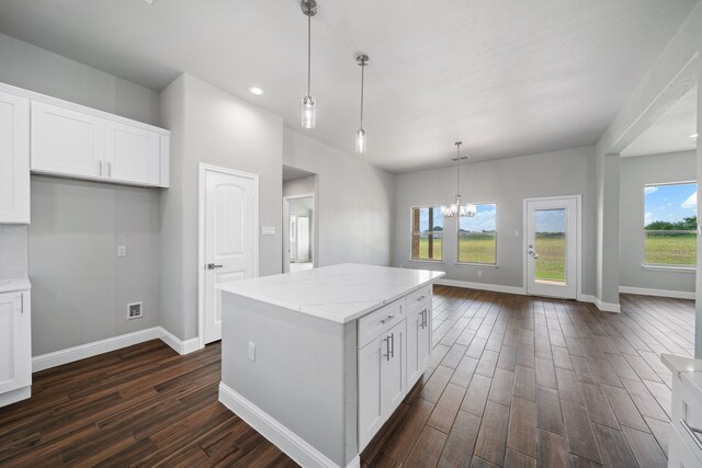 kitchen featuring dark hardwood / wood-style flooring, white cabinetry, and a wealth of natural light