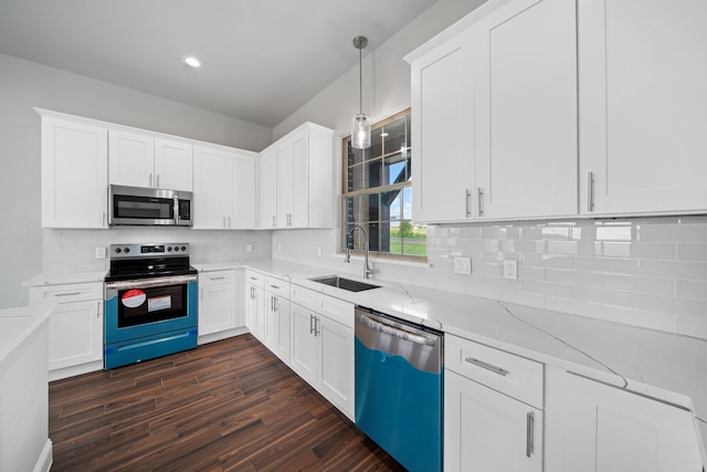 kitchen featuring white cabinetry, appliances with stainless steel finishes, sink, and dark hardwood / wood-style floors