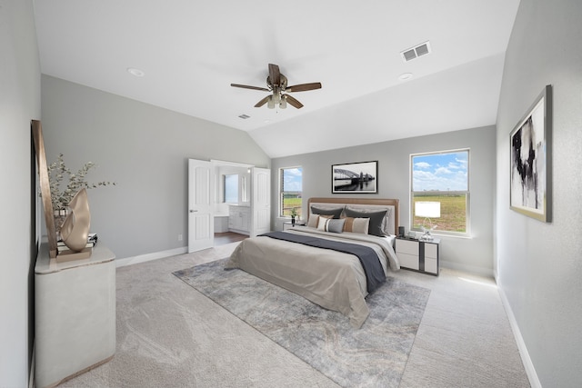 carpeted bedroom with vaulted ceiling and ceiling fan