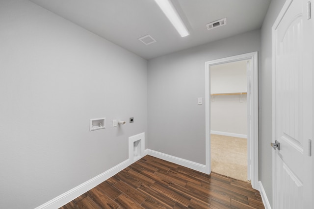 laundry area featuring hookup for an electric dryer, gas dryer hookup, washer hookup, and dark hardwood / wood-style flooring