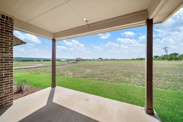 view of patio with a rural view