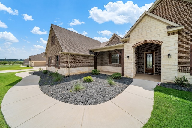 view of front of house with a front lawn and a garage