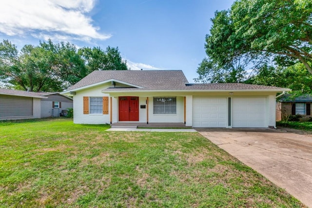 ranch-style home with a front yard and a garage