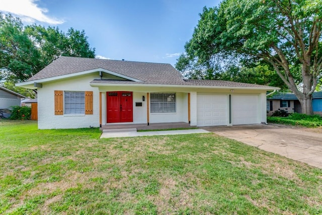 ranch-style house featuring covered porch, a garage, and a front yard