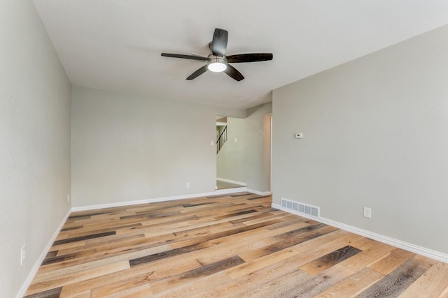 spare room with light hardwood / wood-style floors and ceiling fan