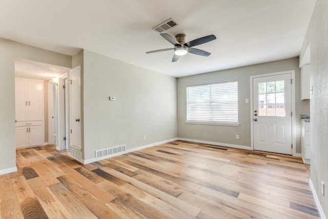 interior space with ceiling fan and light hardwood / wood-style flooring