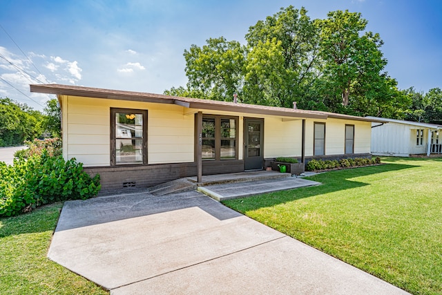 ranch-style house with a front lawn