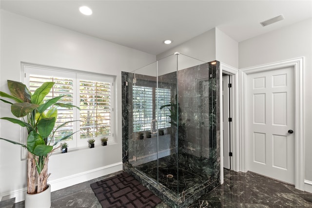 bathroom featuring tile patterned flooring and a shower with shower door