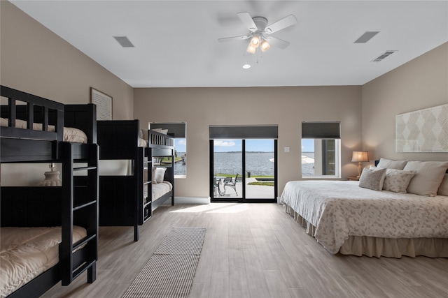 bedroom with ceiling fan, light hardwood / wood-style floors, and access to exterior