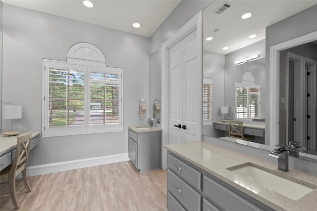 bathroom featuring hardwood / wood-style floors and vanity