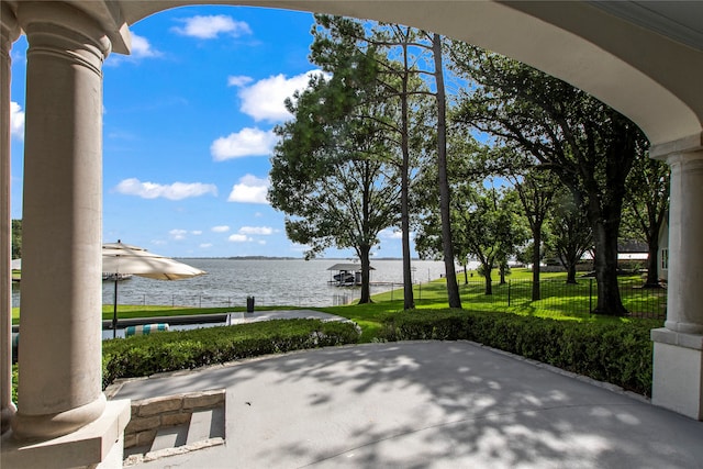 view of patio with a water view