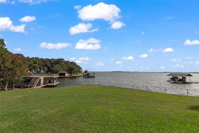 exterior space with a dock and a water view