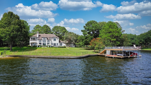 dock area featuring a yard and a water view