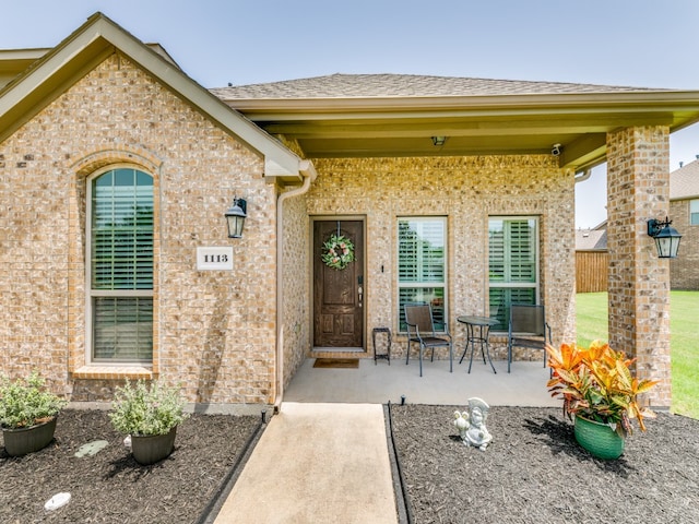 entrance to property with a patio