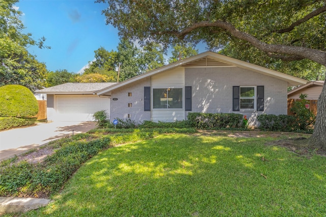 ranch-style home with a garage and a front yard