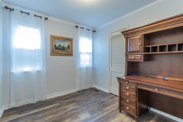 unfurnished office featuring crown molding and dark hardwood / wood-style floors