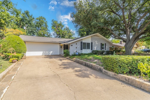 ranch-style house featuring a garage