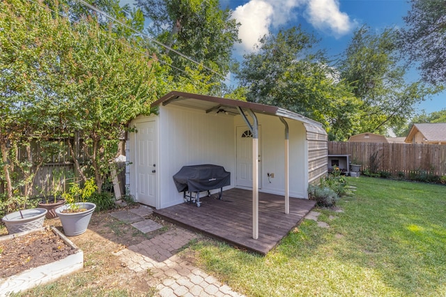 view of outbuilding featuring a lawn