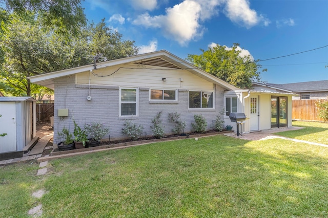 exterior space featuring a shed and a yard