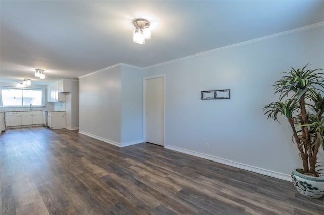 unfurnished living room with crown molding and dark hardwood / wood-style flooring