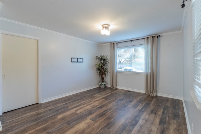 empty room with wood-type flooring and ornamental molding