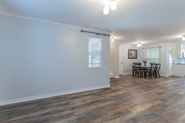 living room with wood-type flooring and crown molding