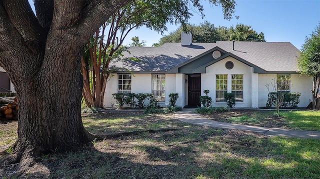 ranch-style home featuring a front yard