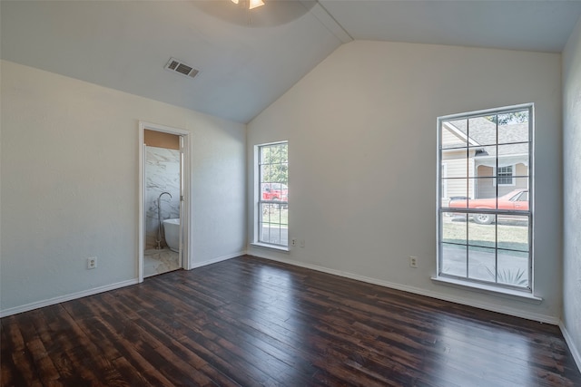 unfurnished bedroom with connected bathroom, ceiling fan, lofted ceiling, and dark hardwood / wood-style flooring