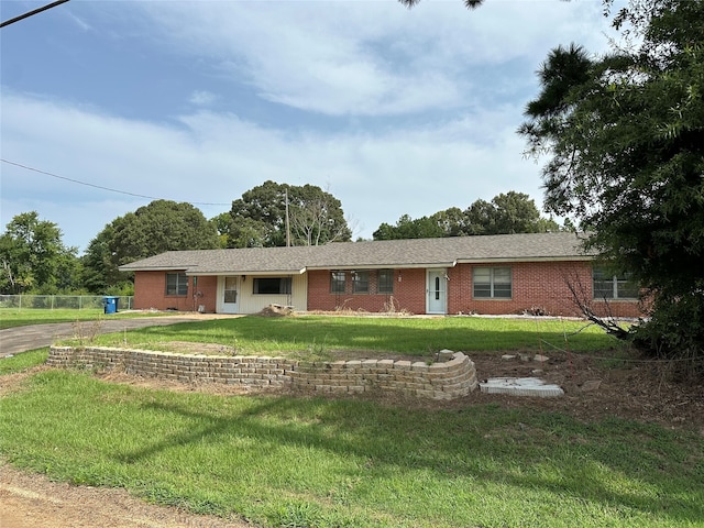 ranch-style house with a front lawn