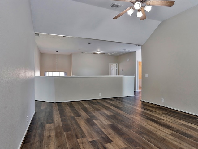 spare room with ceiling fan, lofted ceiling, and dark hardwood / wood-style flooring