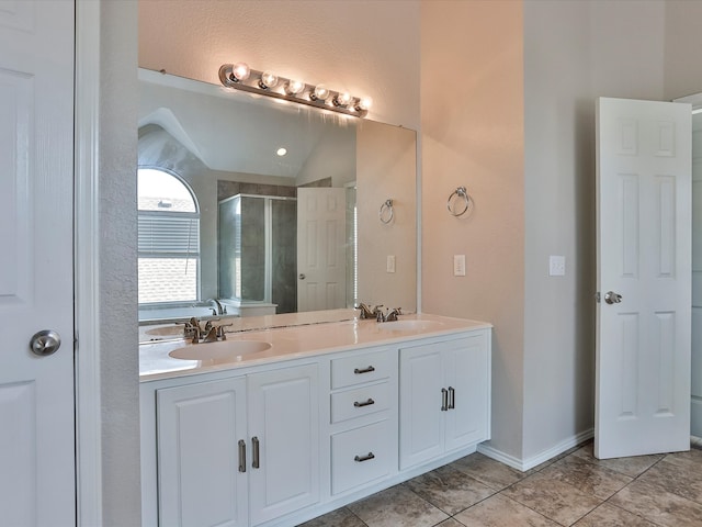 bathroom with lofted ceiling, an enclosed shower, tile patterned floors, and vanity