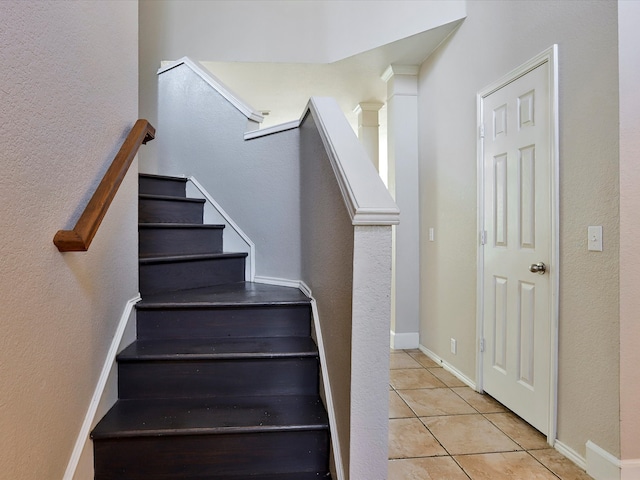 stairs with tile patterned flooring