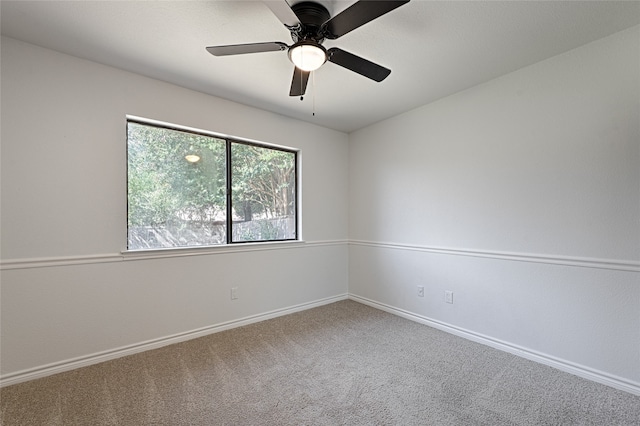 unfurnished room with carpet flooring and ceiling fan