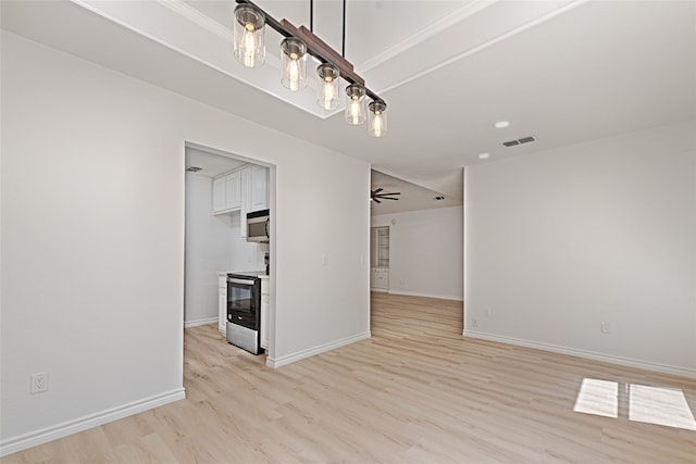 unfurnished dining area featuring light hardwood / wood-style floors and ceiling fan