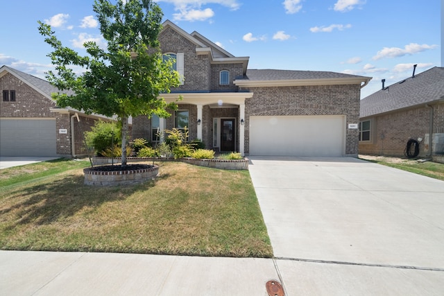 view of front of house featuring a garage and a front yard